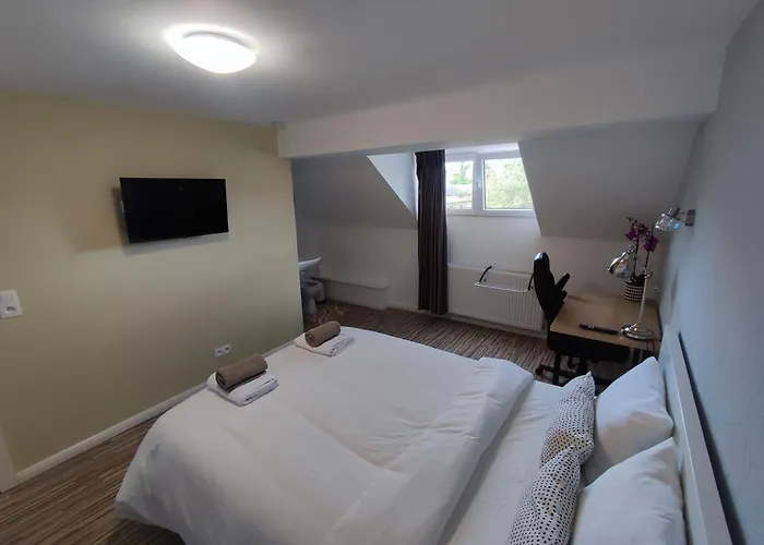 Quarto em Acomodações Particulares Arlon Guest House *